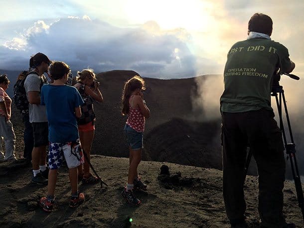 Kids on edge of volcano