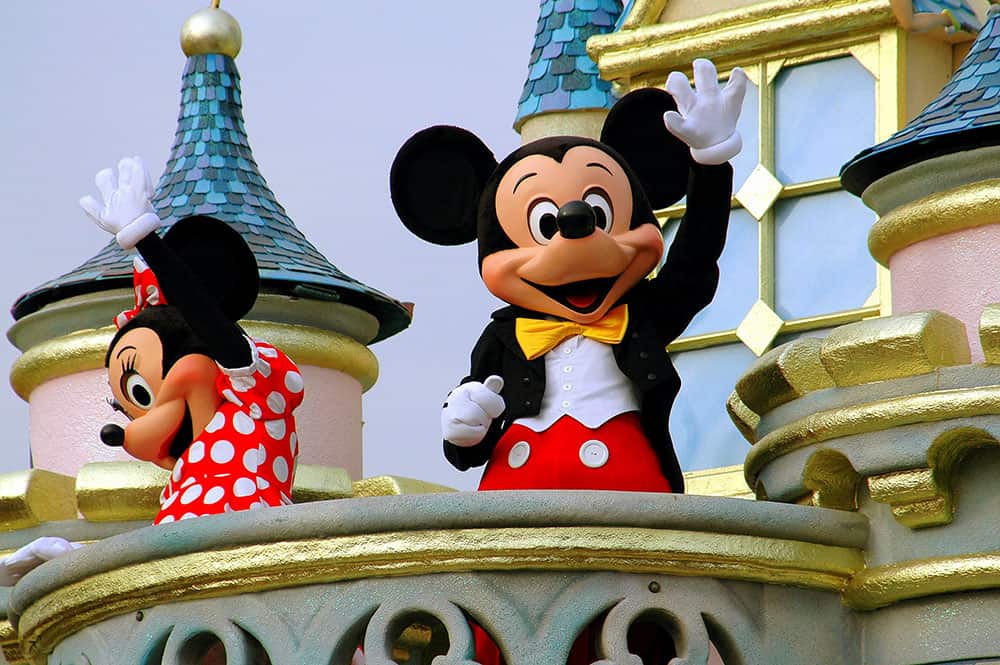 Minnie and Mickey Mouse waving