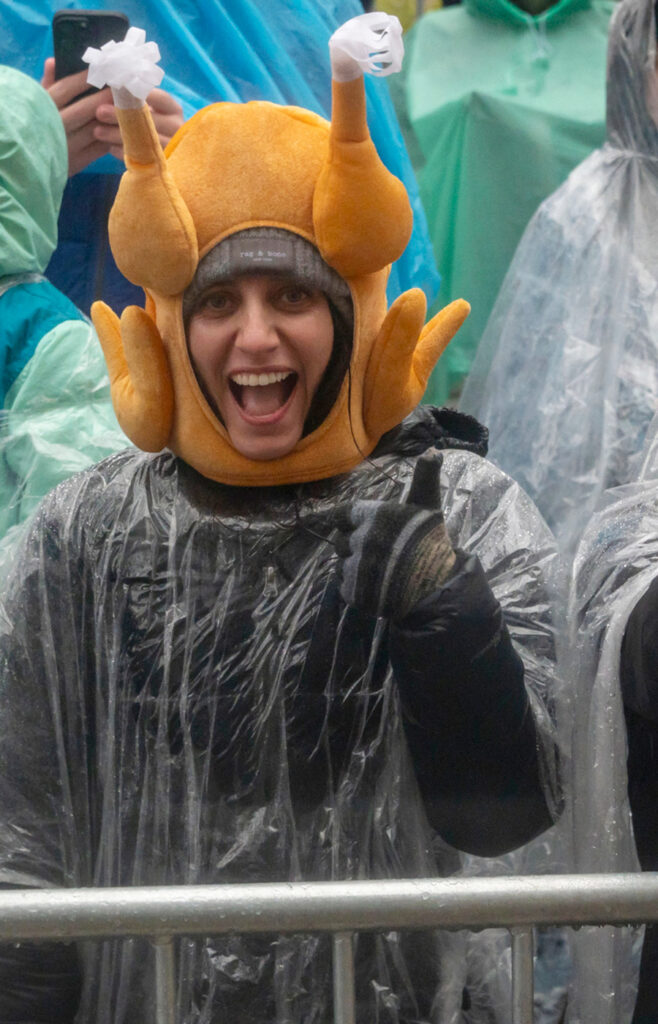 Macy's Thanksgiving Day parade fan in turkey hat