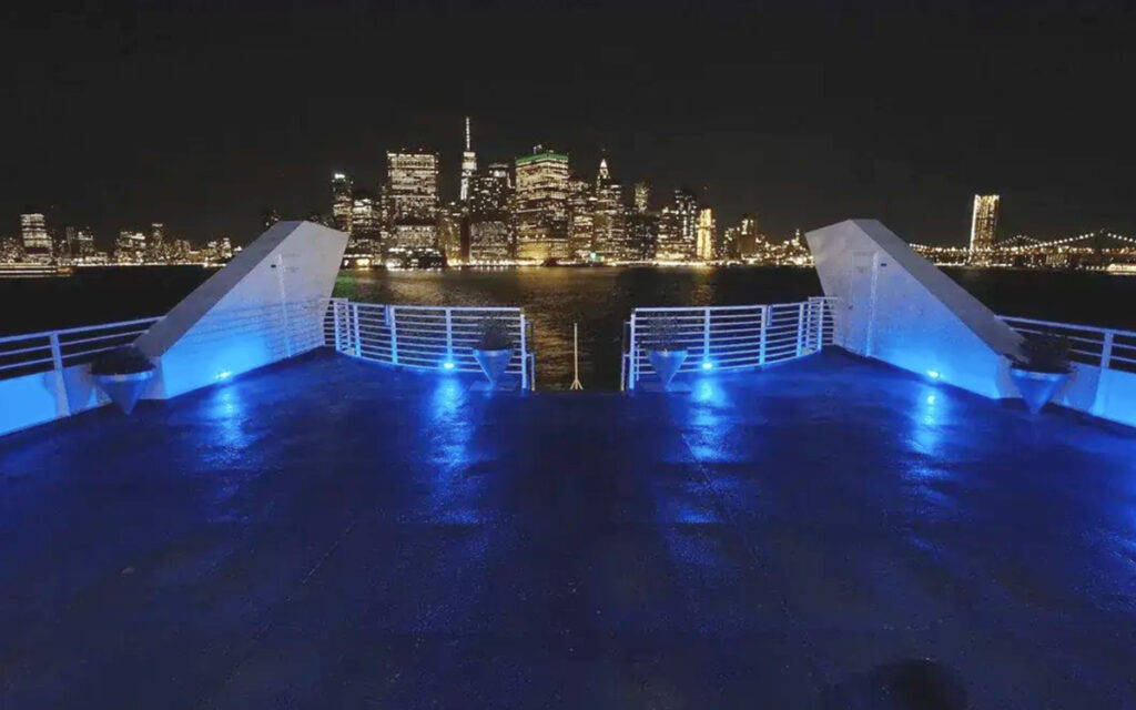 Timeless Yacht top deck with NYC skyline