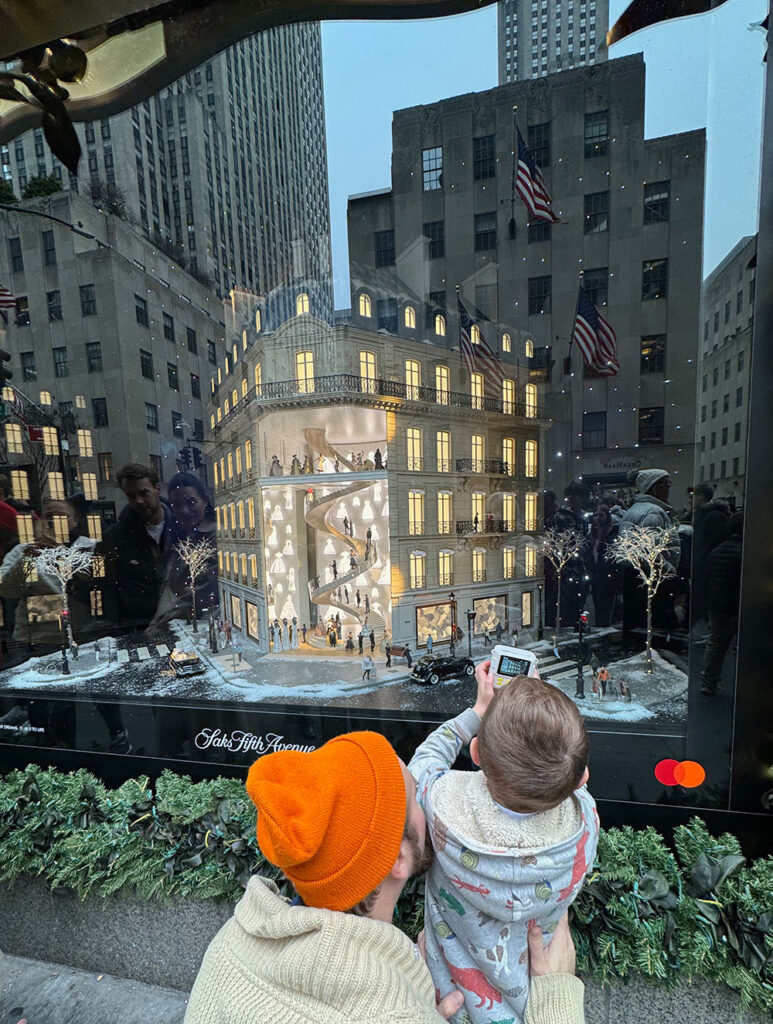 Budding photographer lining up a shot of the Saks Fifth Avenue window
