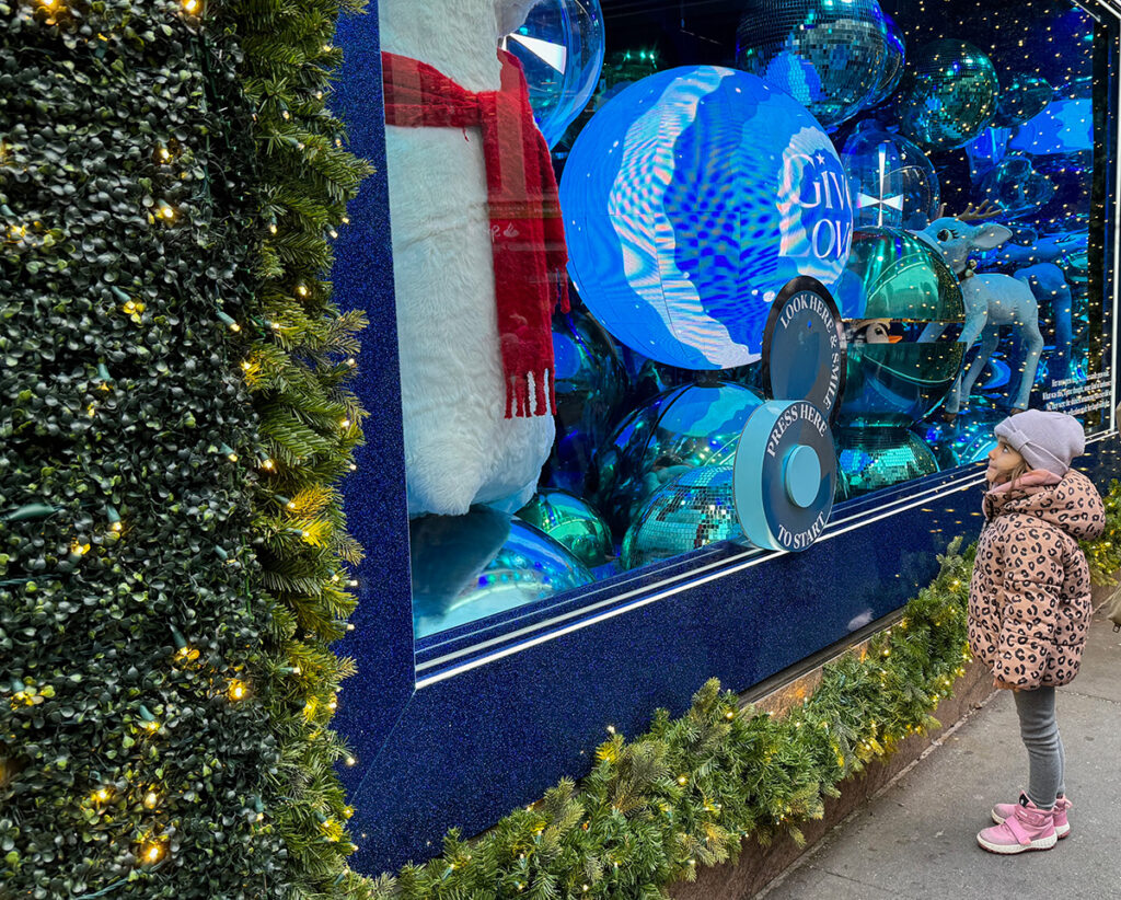 Child looking at Macy's Christmas windows, NYC