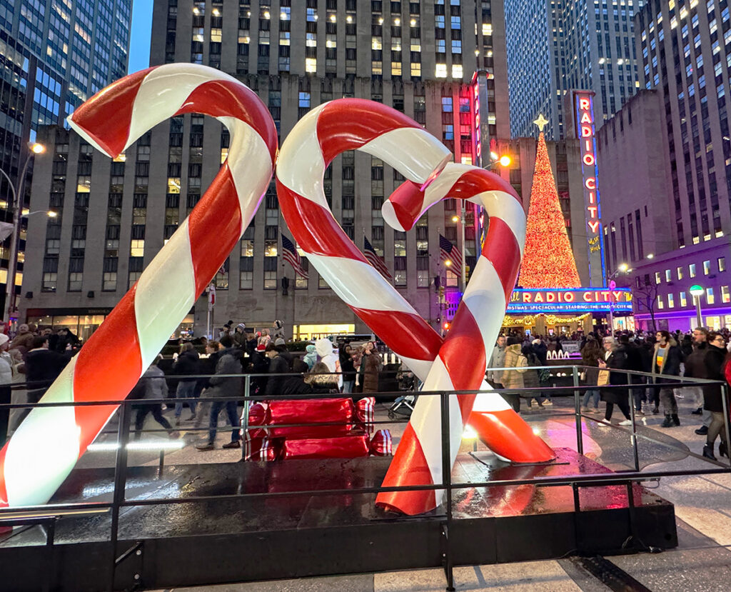 Giant candy canes opposite Radio City Music Hall