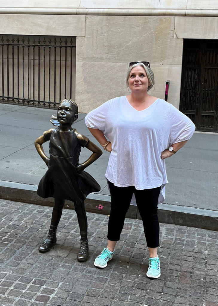 Megan with Defiant Girl statue NY