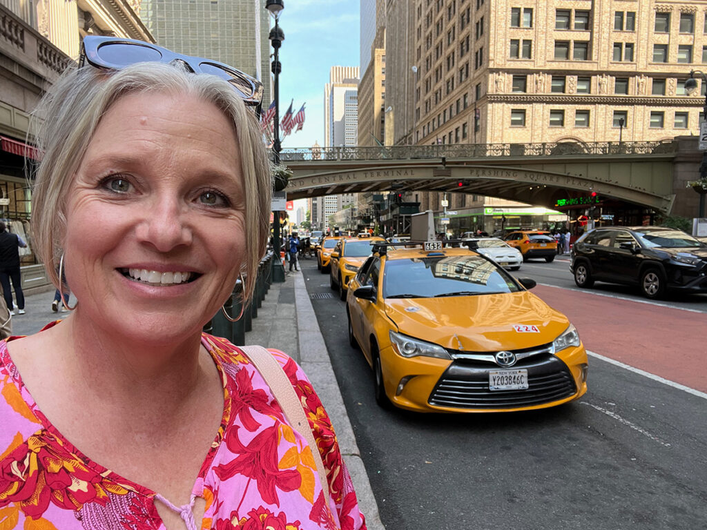 Megan with yellow cabs in New York