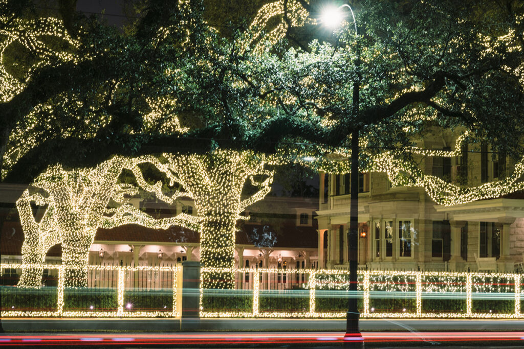 Home and trees lit up in the Garden District