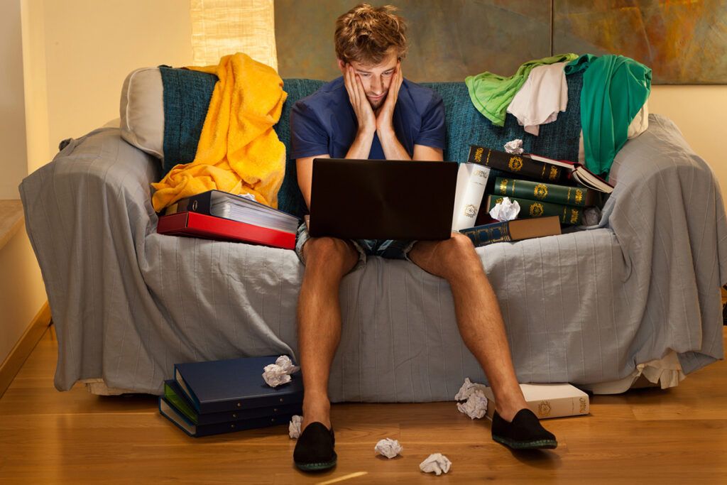 Guy at laptop trying to figure out his itinerary