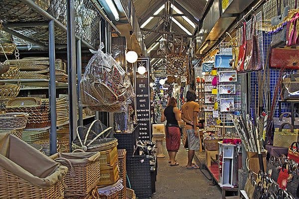 Shopping at Chatuchak Market along the stalls filled with various hand-crafted items.