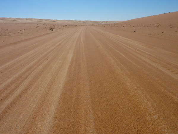 The wide desert road of Oman.