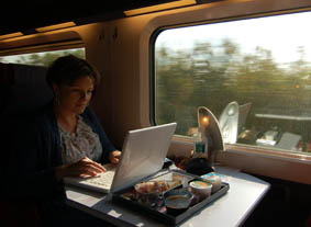 Writing into my laptop for my 8-day trip on a train from starting from London to Belgium, France, and Switzerland.